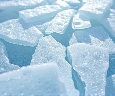 Refreshing ice, chilly, melting slowly, photorealistic, icy tundra environment, highly detailed, small cracks appearing, translucent blue, crisp morning light, shot with a close-up lens.
